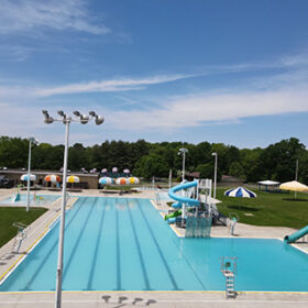 A long view of the main pool in Alameda Park, with lighting and slides
