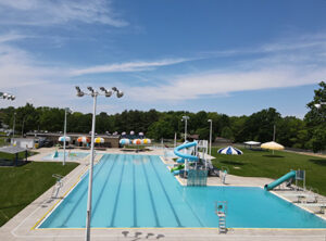 A long view of the main pool in Alameda Park, with lighting and slides